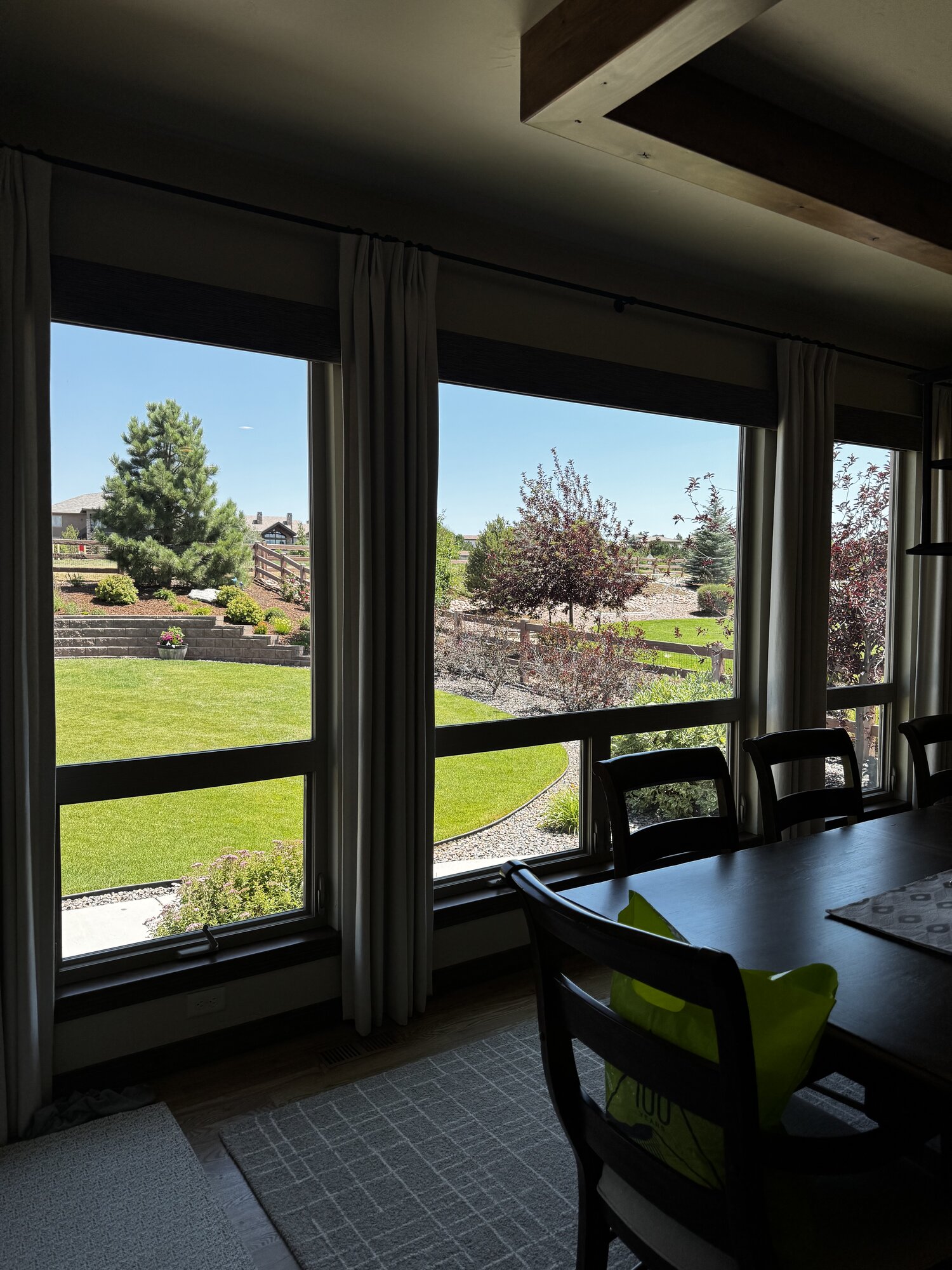 Streak-free dining room windows with backyard view after cleaning