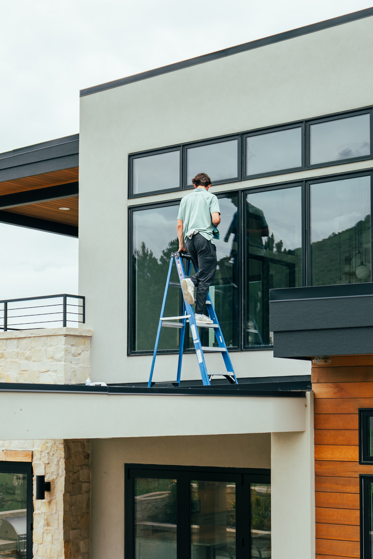 Window cleaning on a modern residential home
